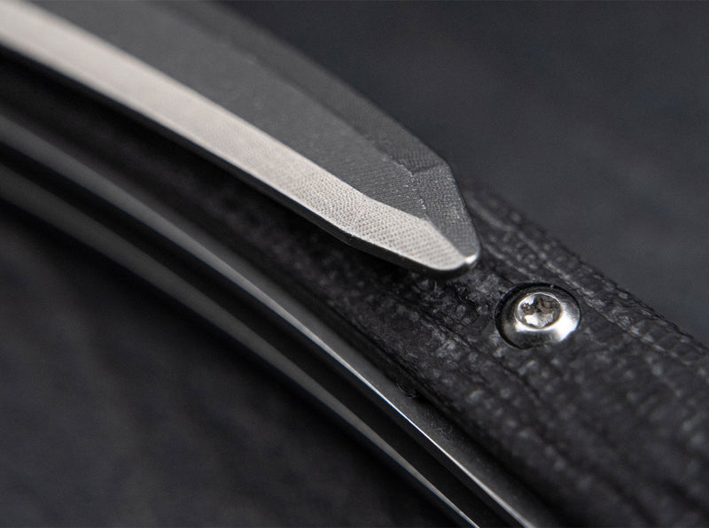 Close up image of a black knife handle.