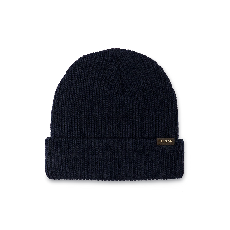 Navy blue colored beanie with a tan Filson logo against a white background. 