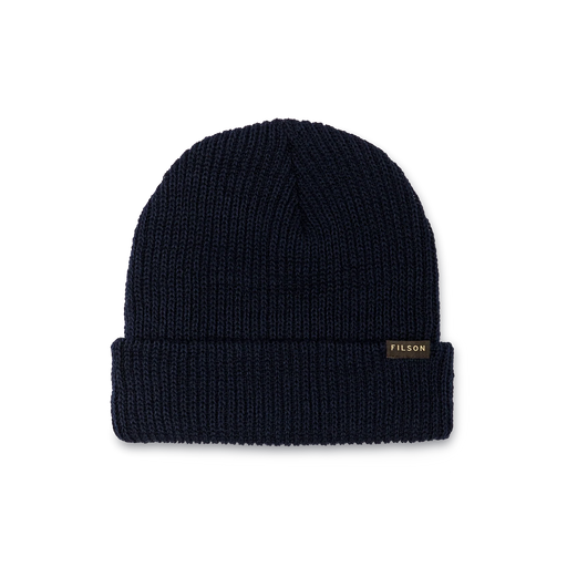 Navy blue colored beanie with a tan Filson logo against a white background. 