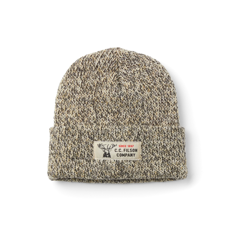 White beanie with black accents featuring a Filson logo against a white background. 