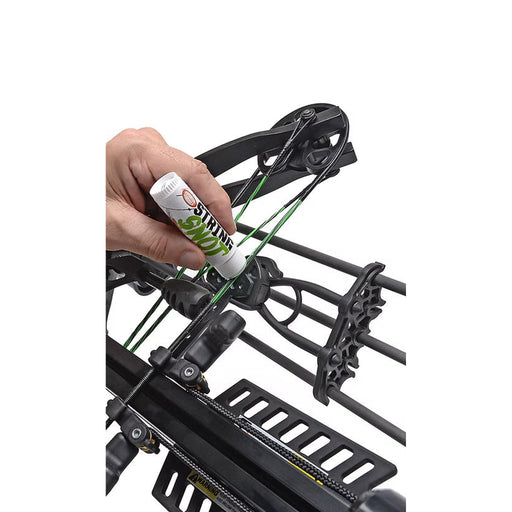 Hand applying a green substance to a bow with a tube labeled 'Sting' on a white background