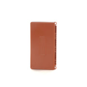 An orange fishing fly box on a white background