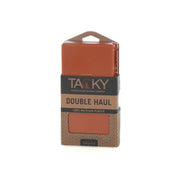 An orange fishing fly box in its package on a white background