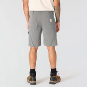 The back of a person wearing a pair of gray cargo shorts on a white background