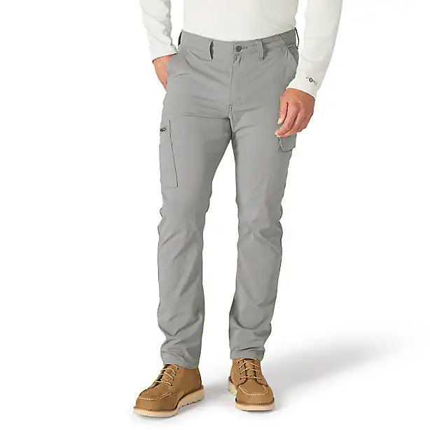 A person wearing gray cargo pants on a white background