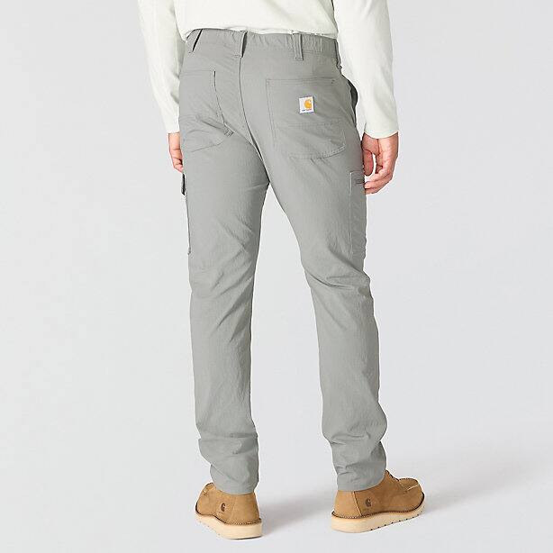 The back of a person wearing gray cargo pants on a white background