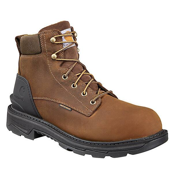 Brown work boot with black sole on a white background