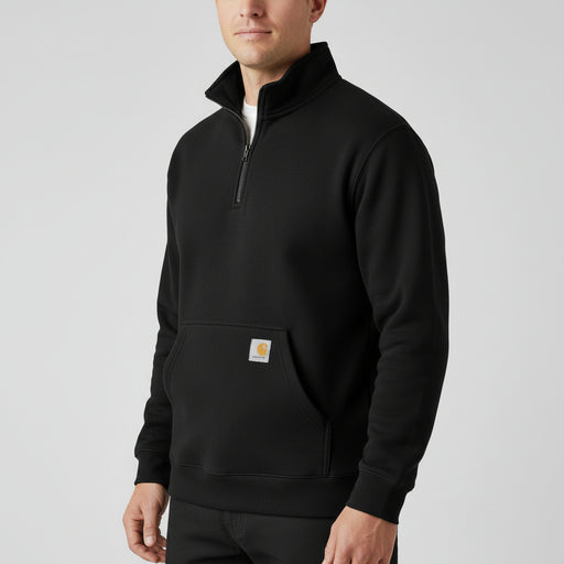 Man wearing a black 1/4 zip jacket with a Carhartt logo on the pocket on a white background.