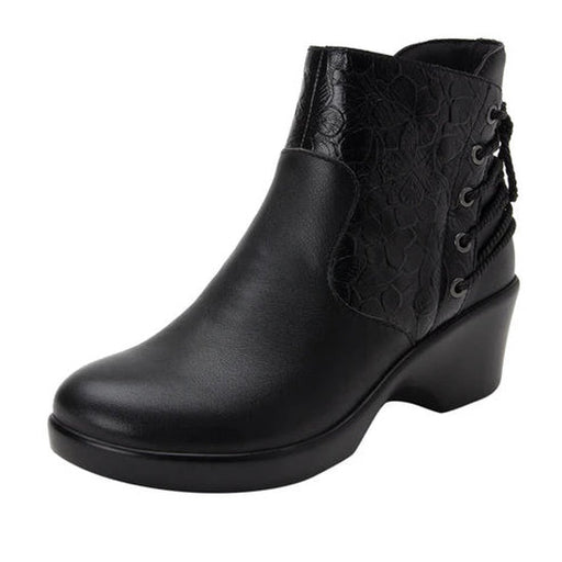 Side view of a black ankle boot with a lace pattern on the back against a white background. 
