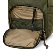 Close up side view of an olive colored backpack with it's side compartment open against a white background. 