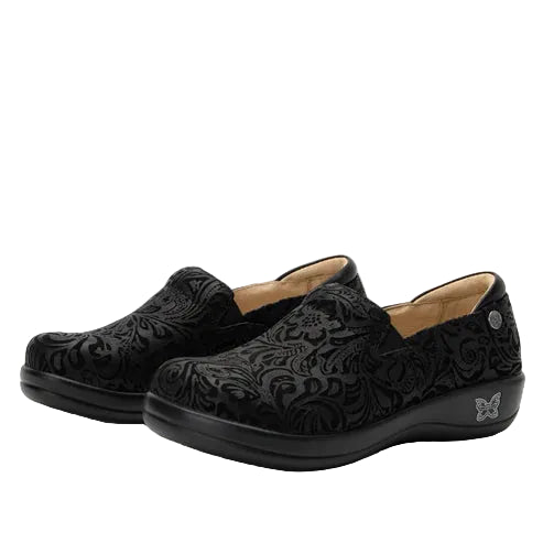 Black patterned shoes on a white background