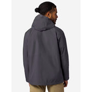 A man wearing a dark gray hooded jacket, shown from the back and side profile against a light gray studio background.