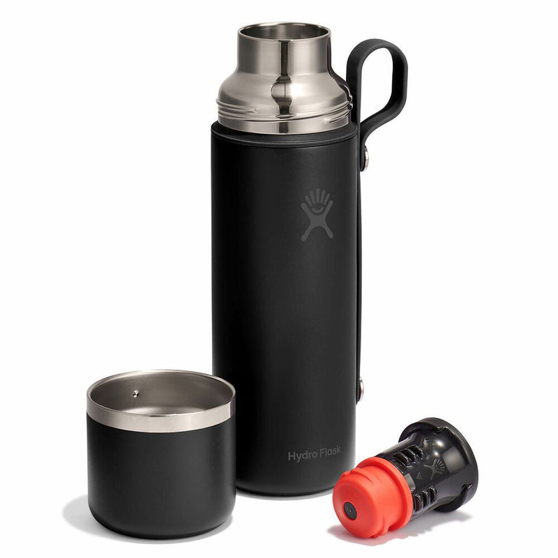 Black thermos with silver lid and black cap on a white background