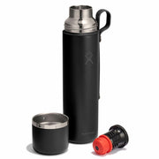 Black thermos with a smaller black cup and red cap on a white background