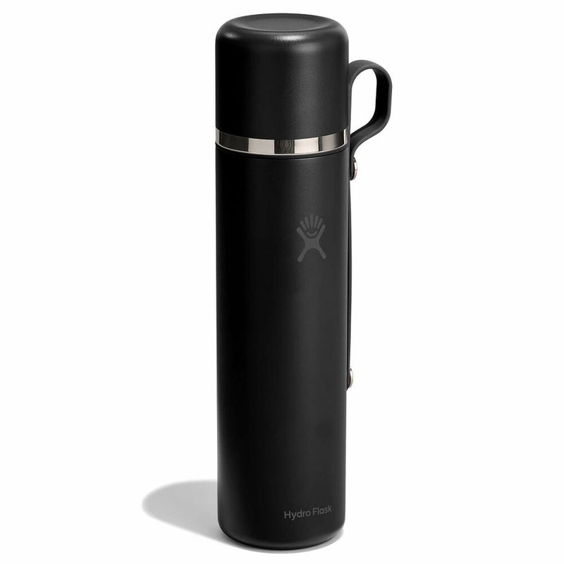 Black thermos bottle with silver band on a white background