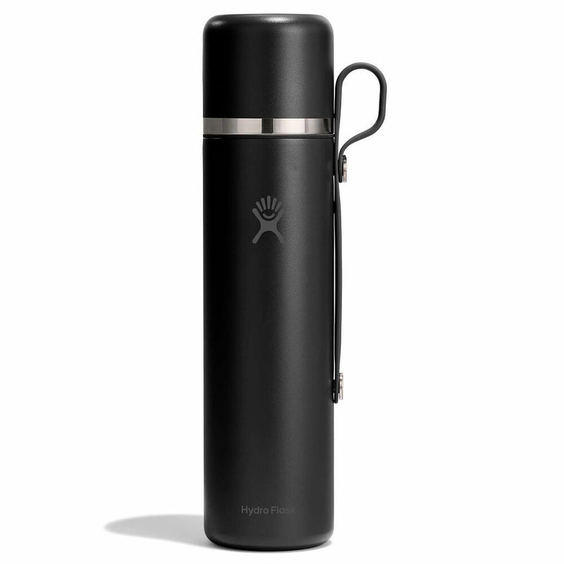 Black hydro flask with silver lid on a white background