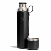 Black hydro flask with a smaller black cup on a white background