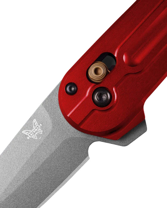 Close-up of a red and gray knife on a white background
