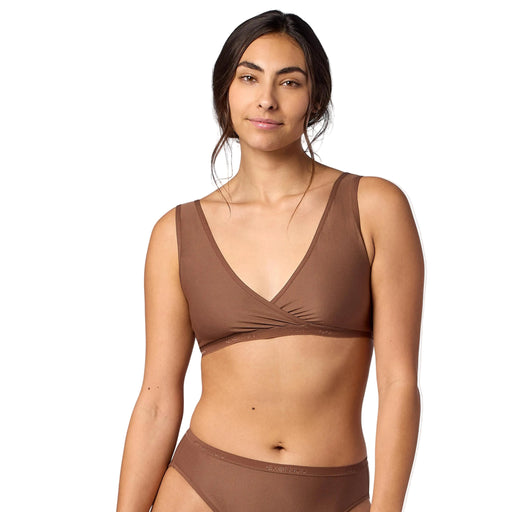 Woman wearing a brown bikini set on a white background