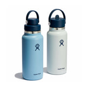 Two Hydro Flask insulated water bottles on a white background, one in light blue and one in off-white, both with dark navy caps and handles.
