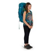 A person wearing a blue hiking backpack on a white background
