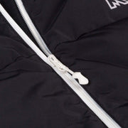 Close-up of a black jacket with a white zipper