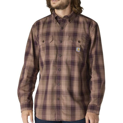 Man wearing a brown plaid shirt with a visible brand logo on a white background