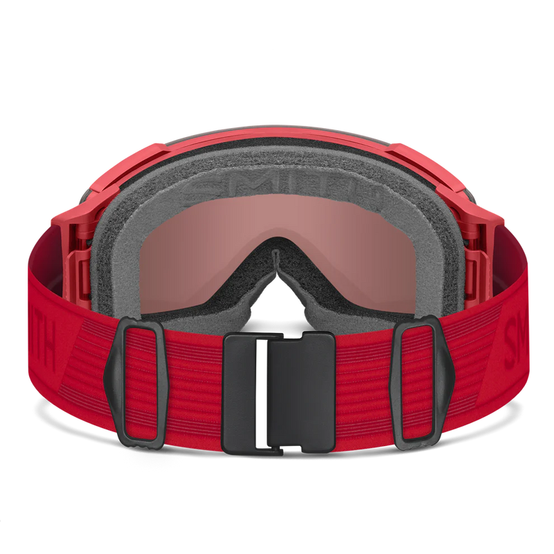Red goggles with a black buckle on a white background