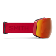 Red ski goggles with orange lens on a white background