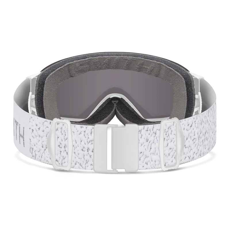 White snow goggles with gray lenses on a white background