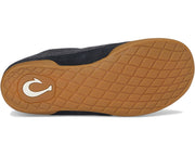Close-up of a shoe sole with brown tread pattern and visible brand logo on a white background