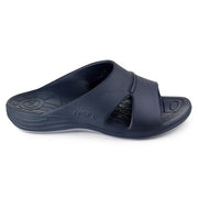 Sideways facing navy blue sandal against a white background. 