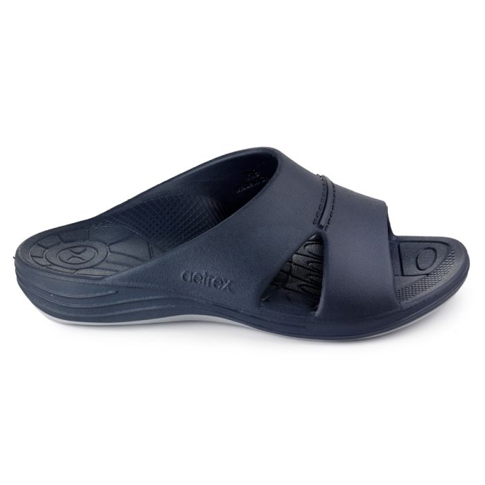 Sideways facing navy blue sandal against a white background. 
