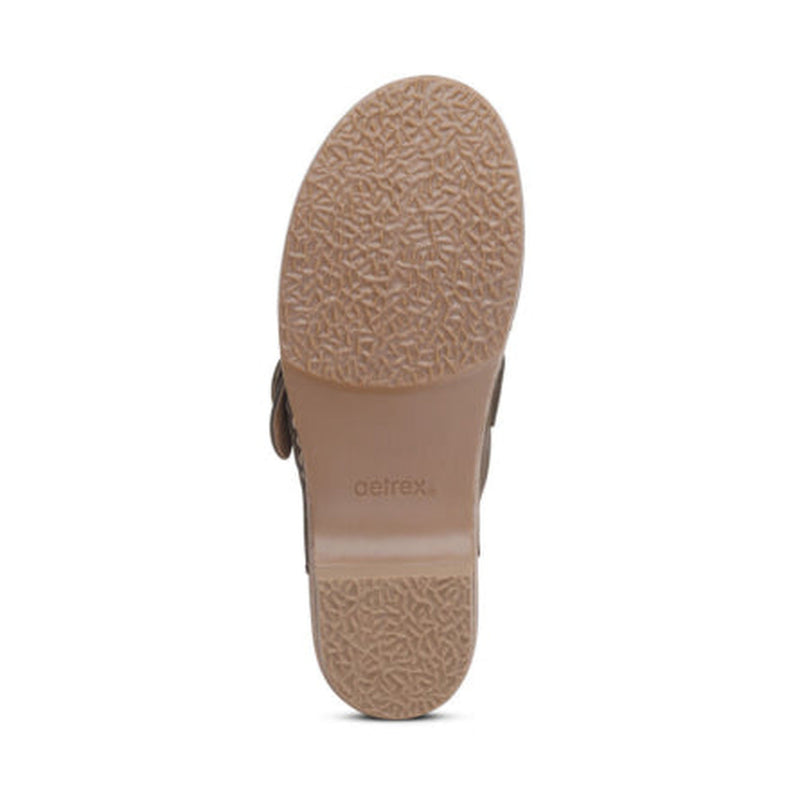 Brown sole with 'Aetrex' branding on a white background