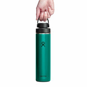 Teal Hydro Flask water bottle with black lid held by a hand on a white background