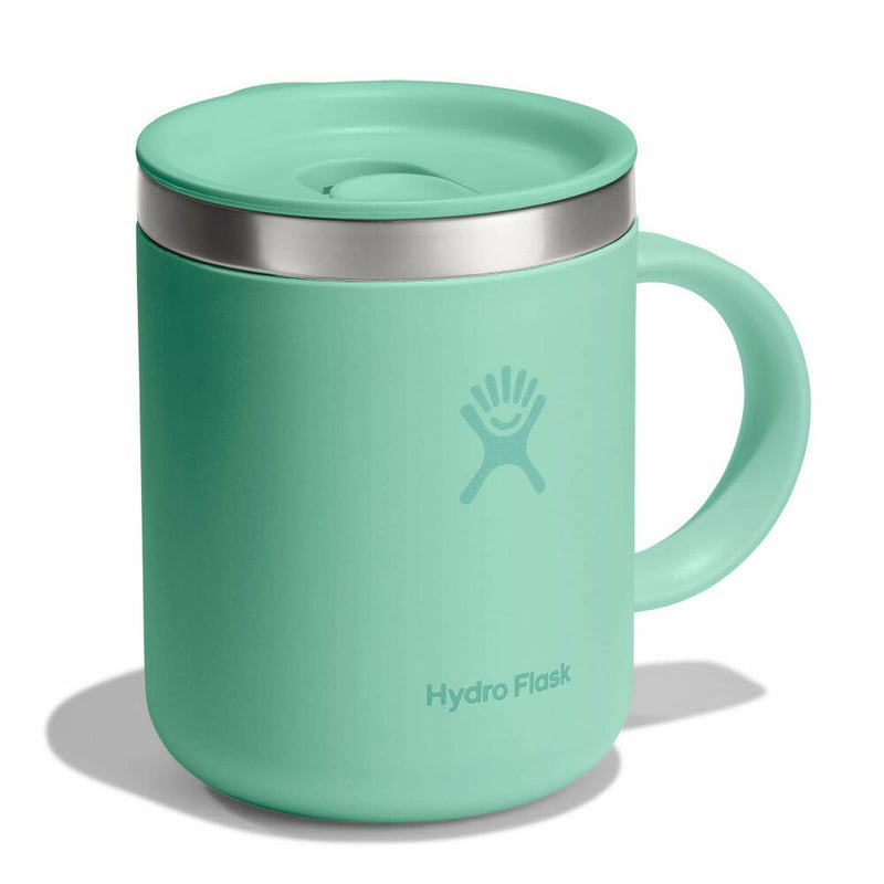 A mermaid green Hydro Flask mug photographed from an angle on a white backgroun