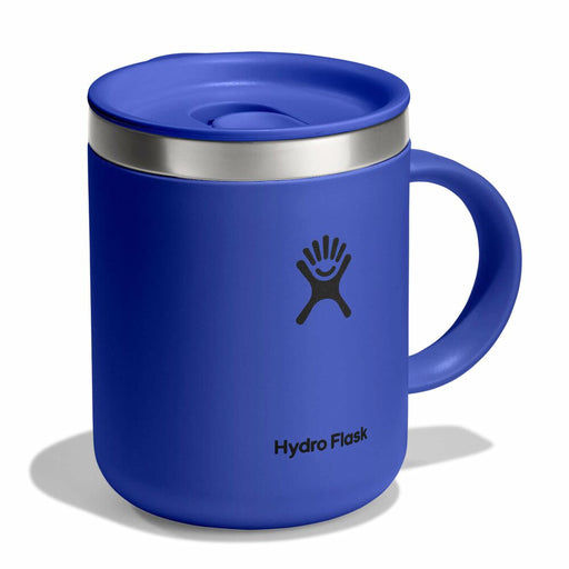 Blue Hydro Flask mug with a silver lid on a white background