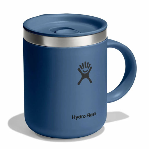 Blue Hydro Flask mug with a silver lid on a white background