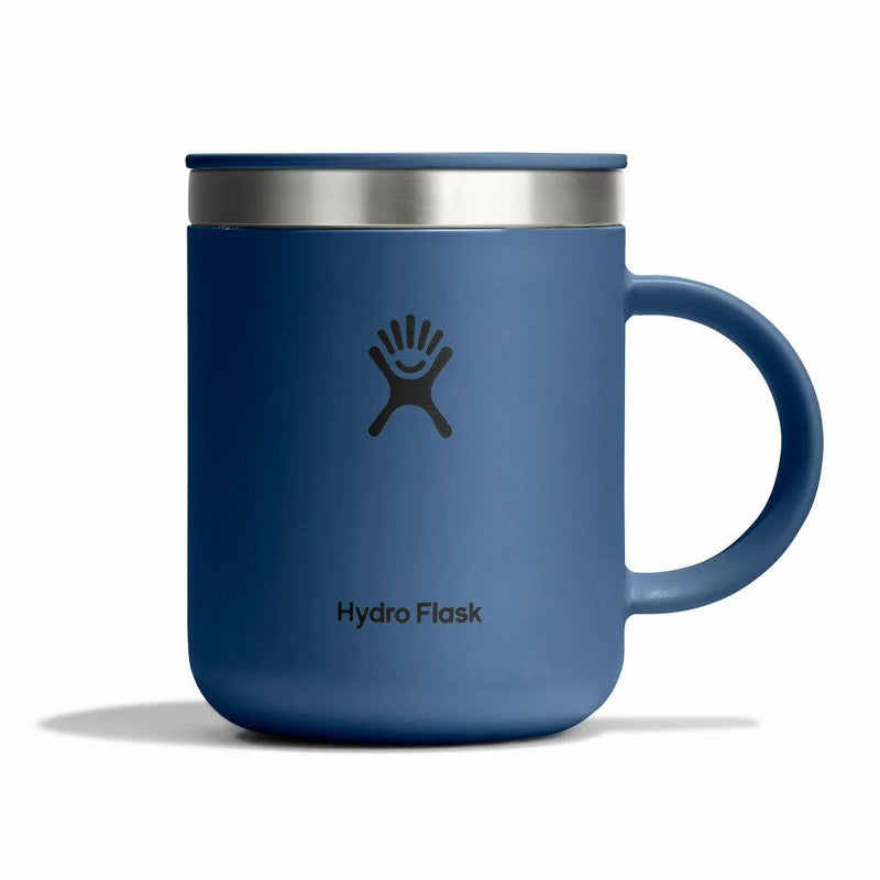 Blue Hydro Flask mug with silver rim on a white background