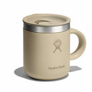 Beige Hydro Flask mug with lid on a white background