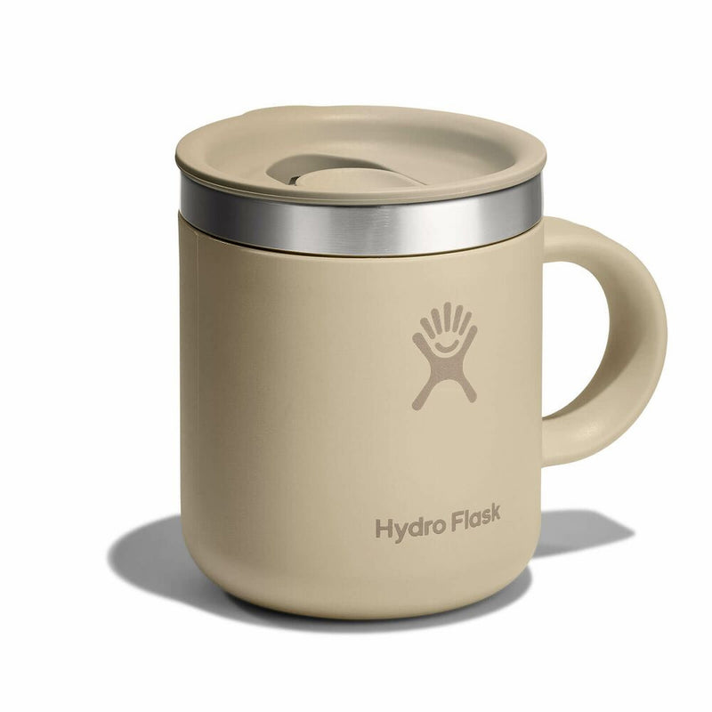 Beige Hydro Flask mug with lid on a white background