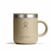 Beige Hydro Flask mug with silver lid on a white background