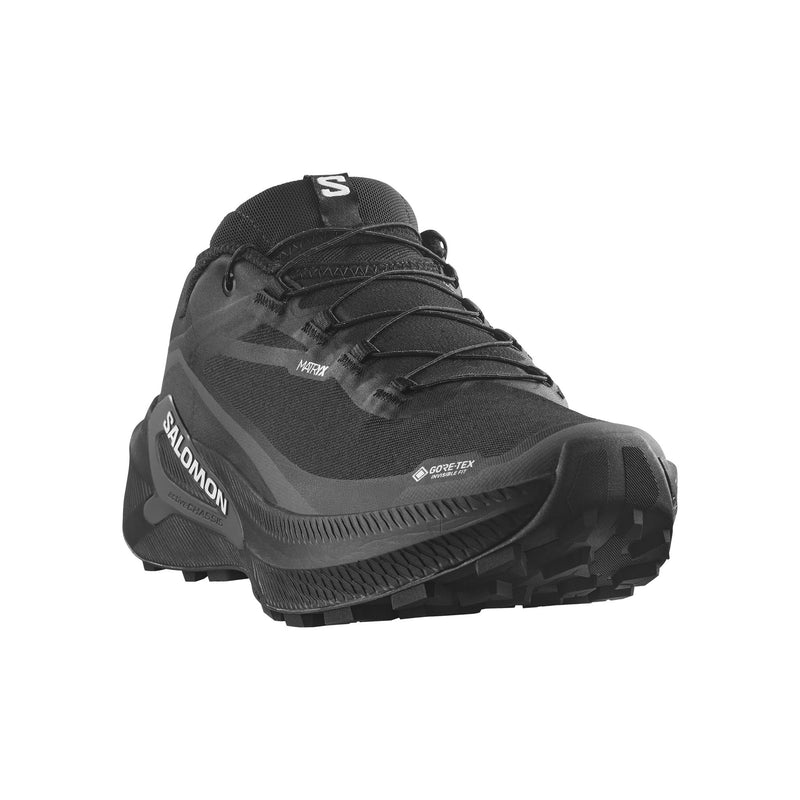 A Salomon sneaker in black and dark gray, shown from a three-quarters angle against a plain white background.