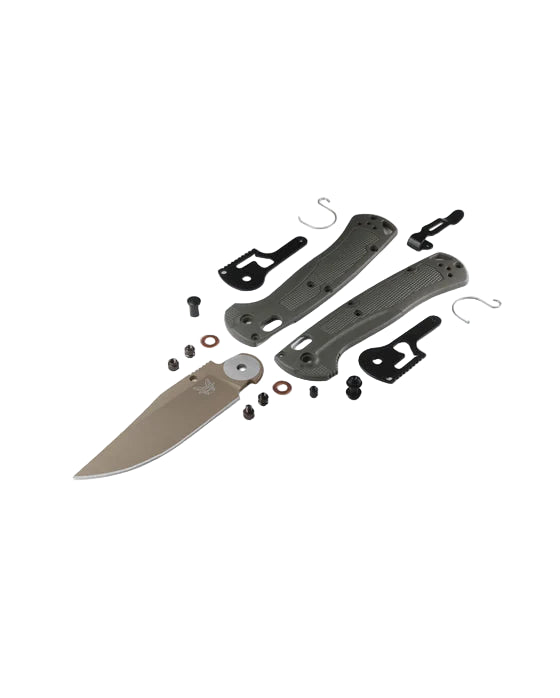 Disassembled knife with various components on a white background