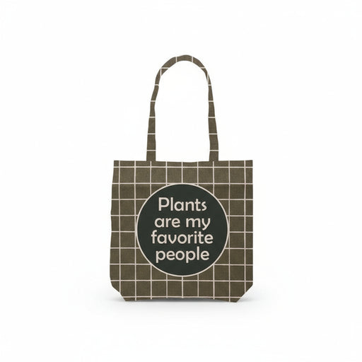 Green tote bag with white crosshatch pattern featuring a text that reads plants are my favorite people against a white background. 