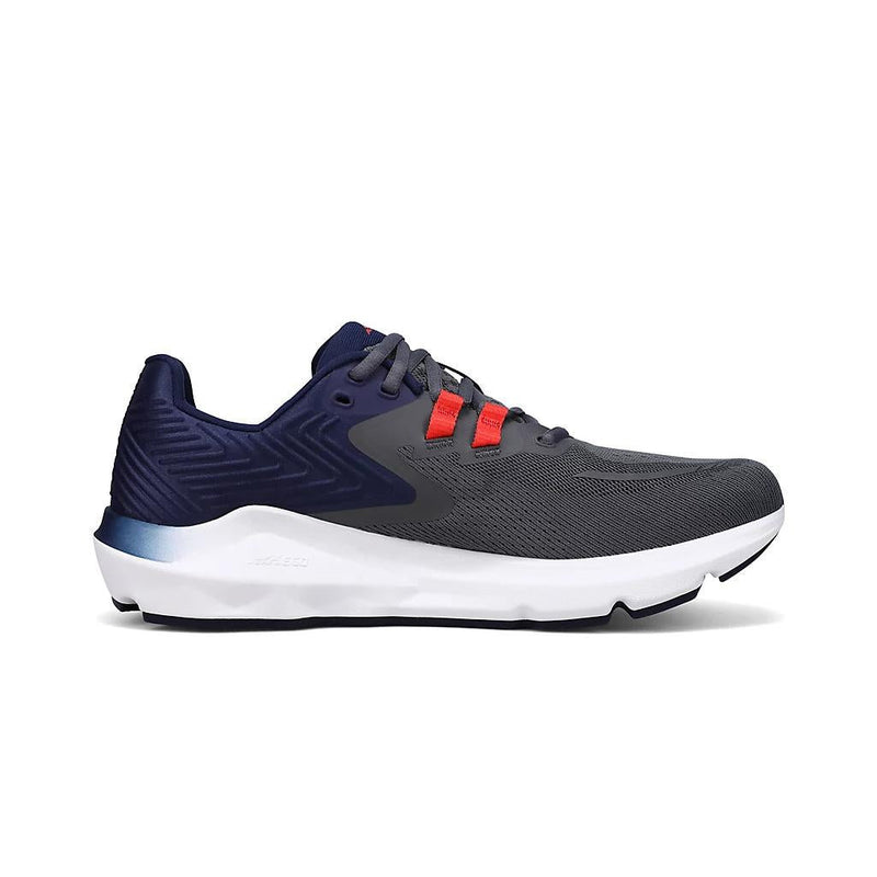 A gray running shoe with a white bottom on a white background