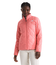 Person wearing a pink quilted jacket on a white background