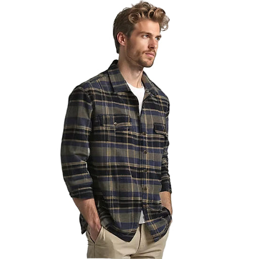 Man wearing a plaid shirt on a gray background