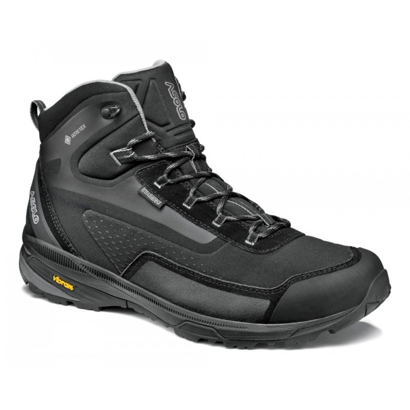 Side view of a black winter hiking boot against a white background. 