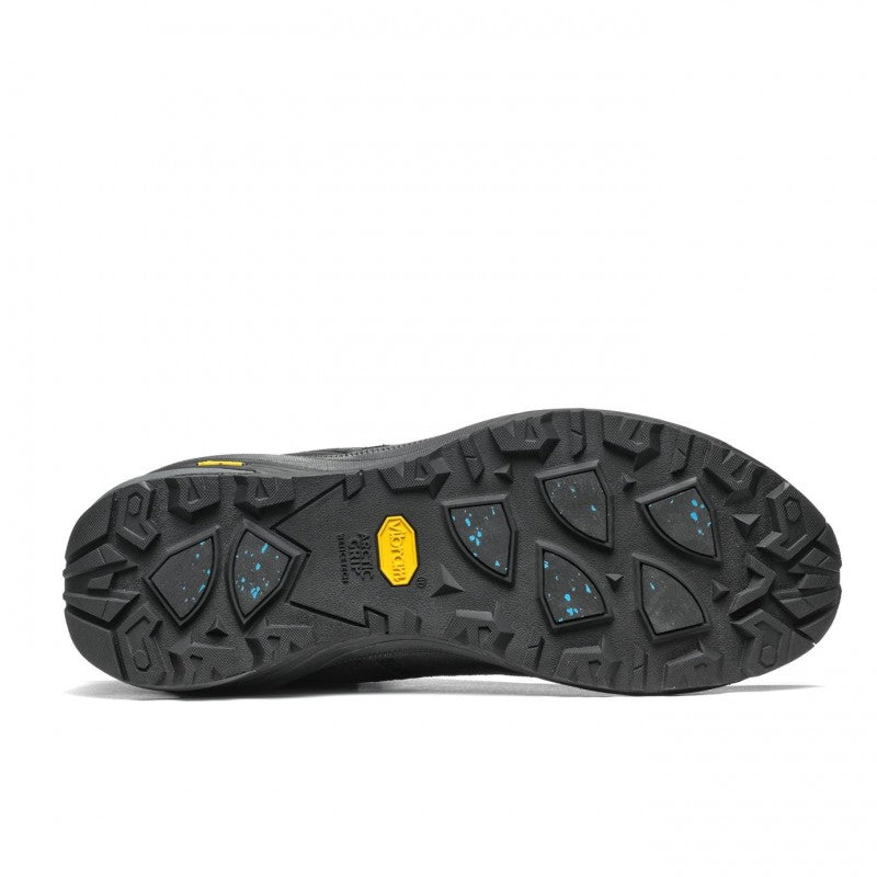 Bottom view showcasing the tread of a black winter hiking boot against a white background. 